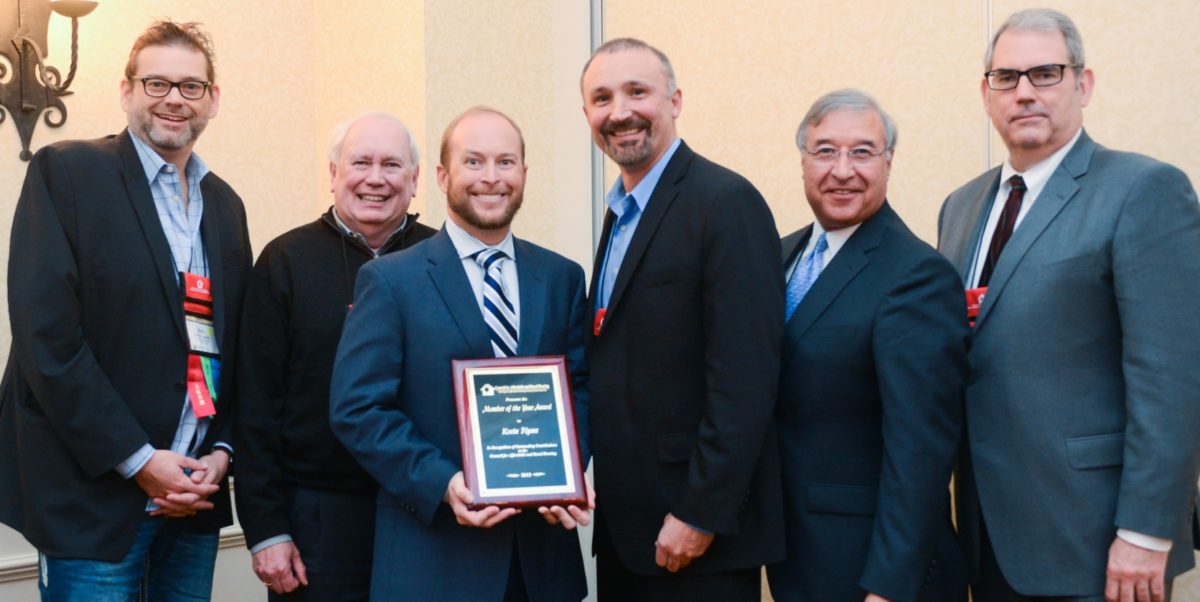 Pictured with Kevin Flynn are (from left to right) David Layfield (2015 Member of the Year), Charles Bringardner (2013 Member of the Year), Lowell Ray Barron II (Current CARH President), Tony Hernandez (Administrator, Rural Housing Service) and Don Beaty (2014 Member of the Year).